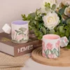 KAMMAK floral ceramic mug pair styled on books and a wood stand KAMMAK 7KPSP434N ceramic cup and saucer scale and proportion view image 6