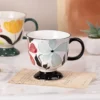 floral-ceramic-tea-cup-gx006-4 KAMMAK 8CZGX006 ceramic cup and saucer front view for product display