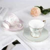 tea-cup-set-sweet-dream-lotus-melody-5 KAMMAK 8CZRX019+20 ceramic cup and saucer front view for product display