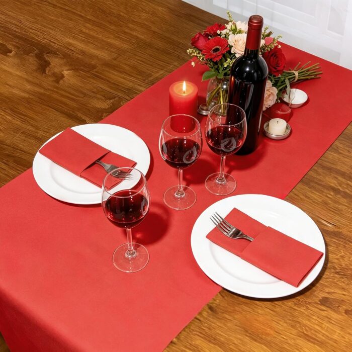 KAMMAK Red Disposable Paper Table Runner Roll, 16.5 in × 78.7 ft – image 5 KAMMAK 7KPSP997N dinner napkins styled on dining table image 5