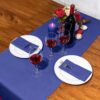 KAMMAK Navy Blue Disposable Paper Table Runner Roll, 16.5 in × 78.7 ft – image 5 KAMMAK 7KPSP998N dinner napkins styled on dining table image 5